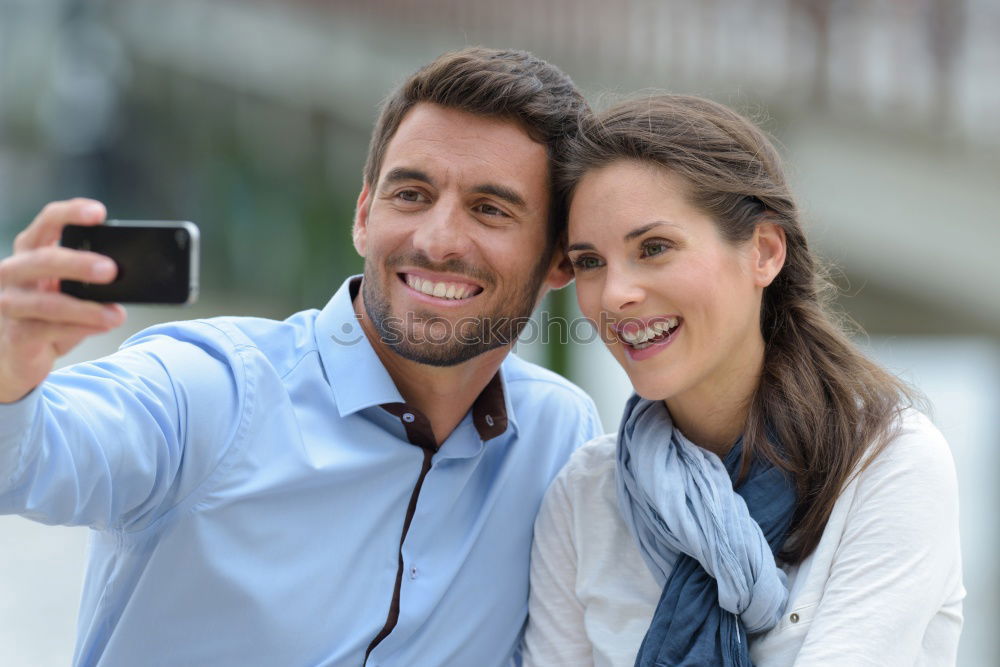 young cheerful couple taking a selfie