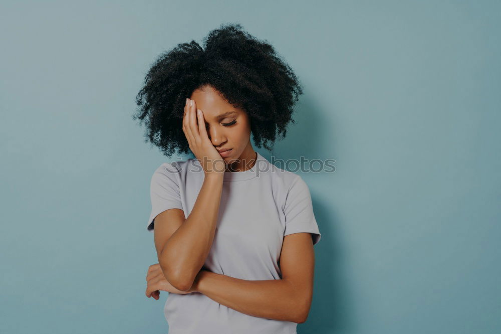 Similar – Portrait of beautiful afro woman covering her face.