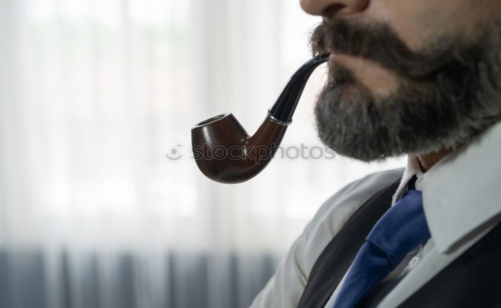 Similar – Barber cutting beard to man in salon