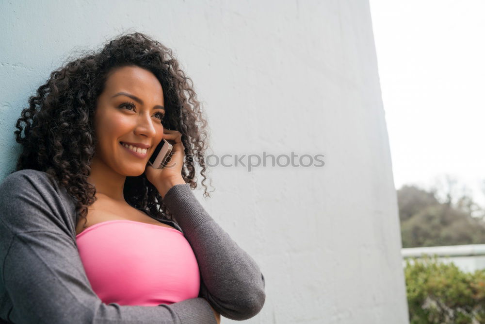 Similar – Smiling young adult woman talking on the phone