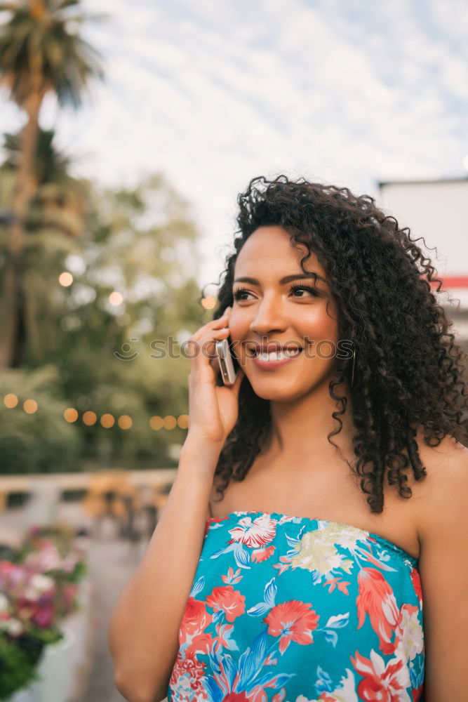 Similar – Smiling young adult woman talking on the phone