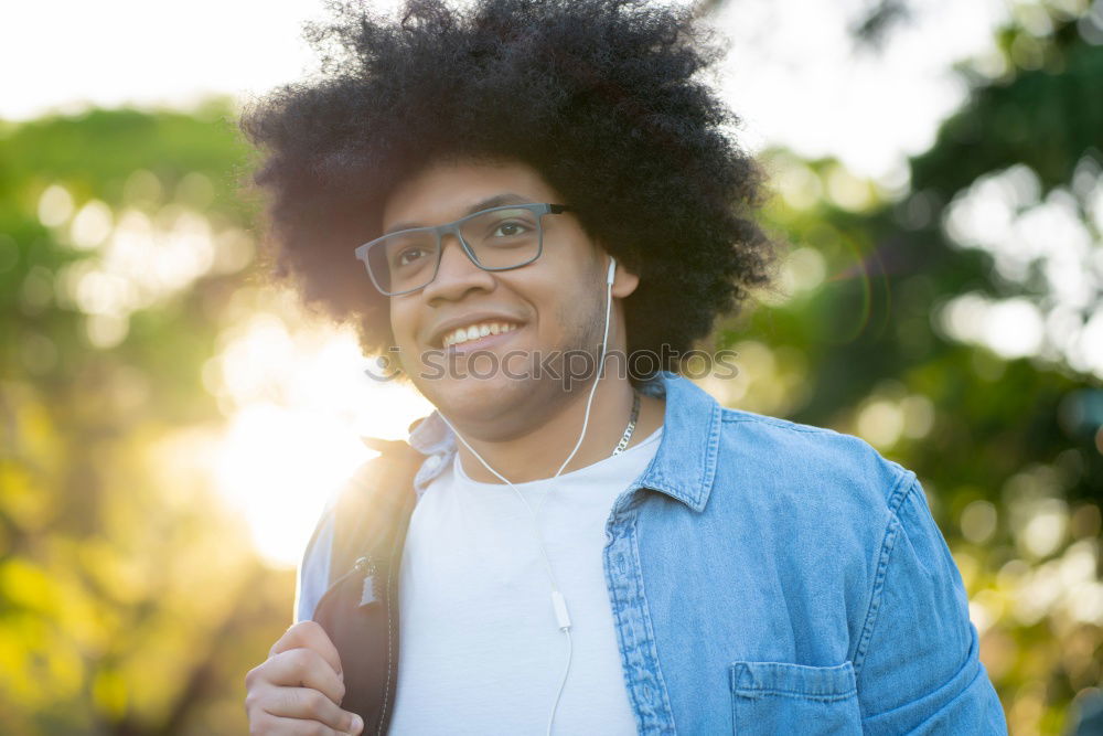 Similar – Image, Stock Photo Young beautiful Afro-American woman posing and smiling while standing against brick wall