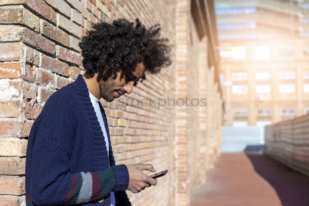 Similar – Image, Stock Photo Young black man using smart phone outdoors