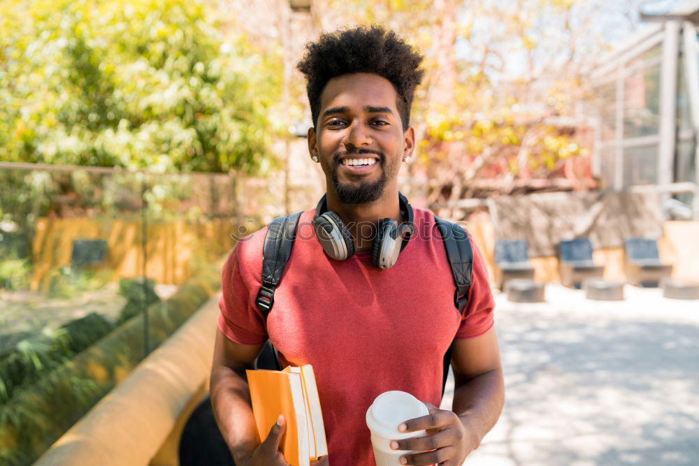 Similar – Image, Stock Photo Young black man wearing casual clothes walking smiling down the street