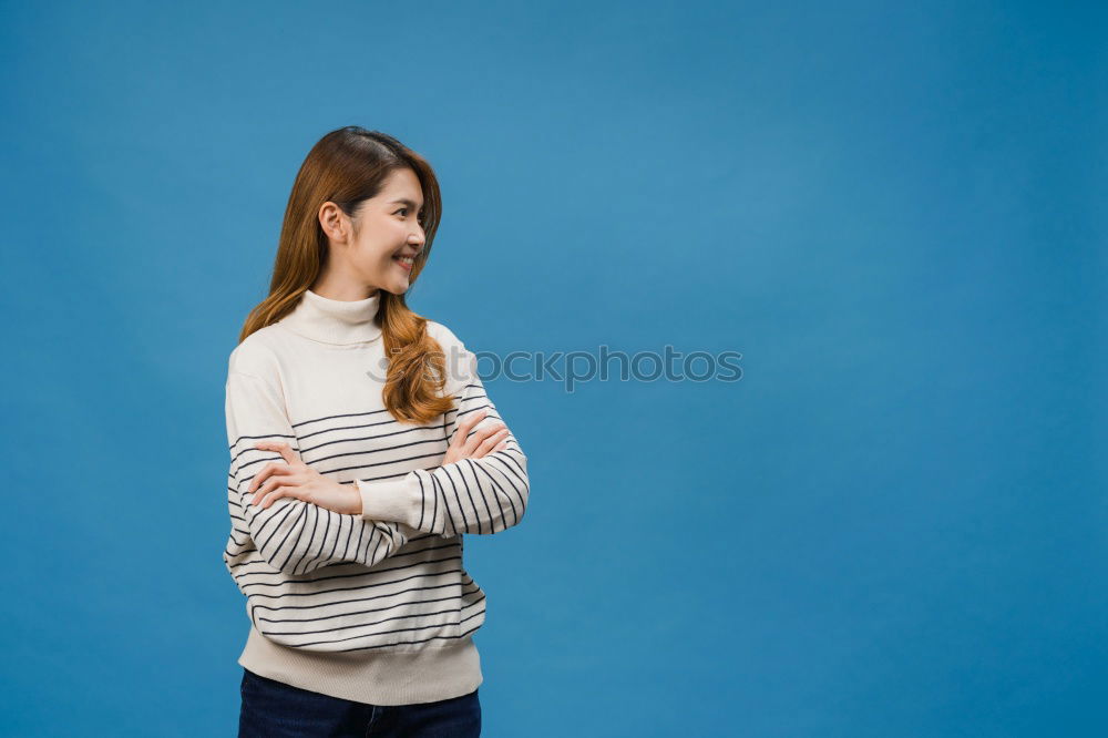 Similar – Cheerful woman in yellow jacket