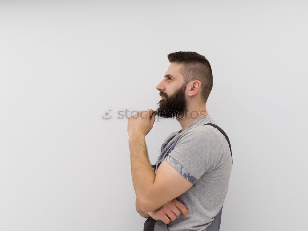 Similar – Man with cup and phone at window