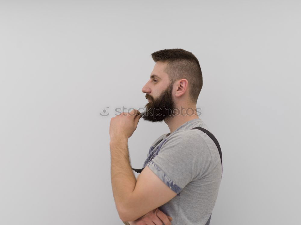 Man with cup and phone at window