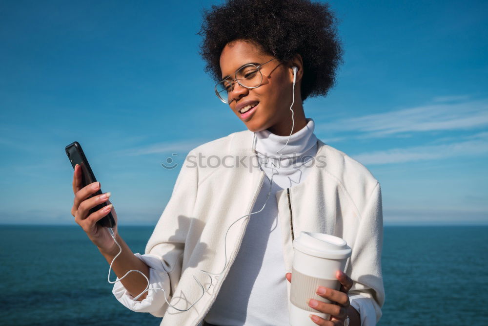 Similar – Image, Stock Photo Beautiful afro american woman using mobile in the street.