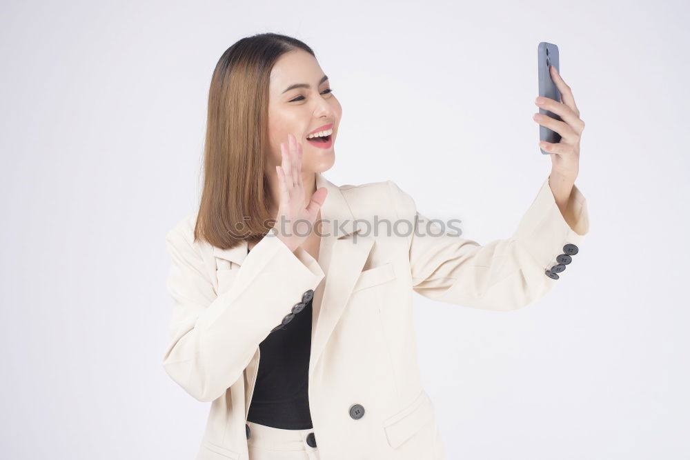 Similar – Image, Stock Photo Happy young woman on the tablet by the wall