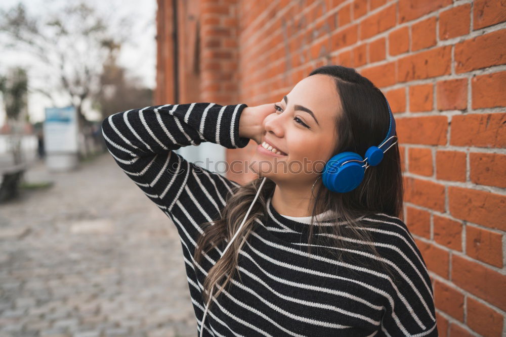 Similar – Happy caucasian women listening to music on smart phone