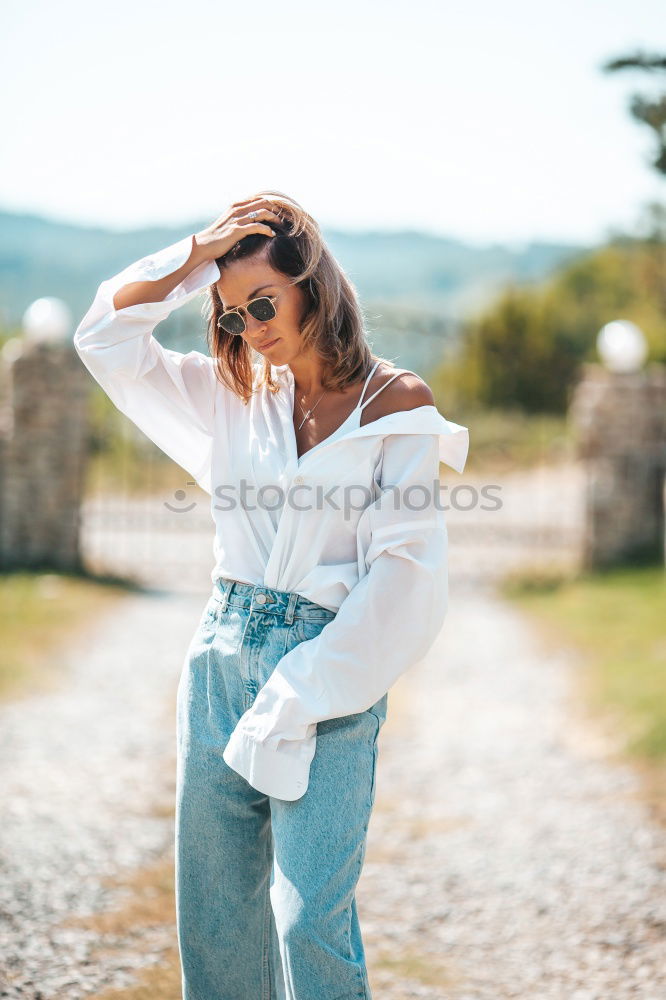 Similar – Image, Stock Photo Happy young blond woman standing on urban background.