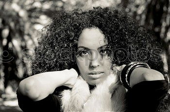 Similar – Image, Stock Photo Portrait of young beautiful dark skinned woman looking at camera