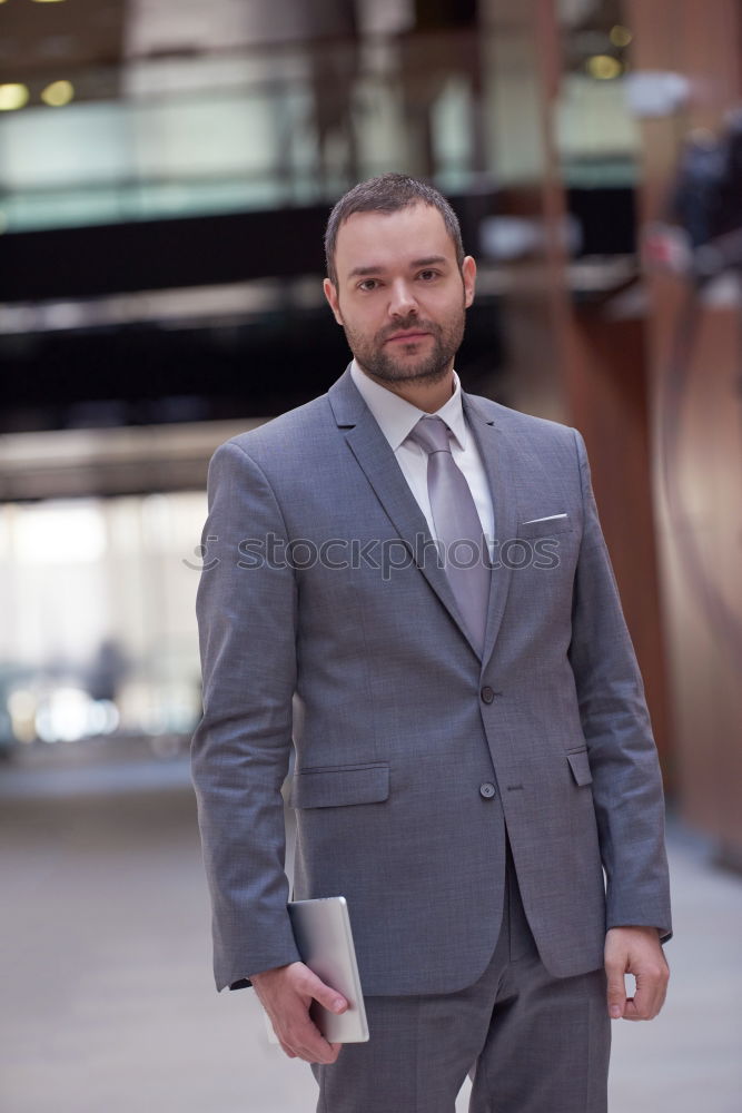 Similar – Senior businessman walking outside of modern office building