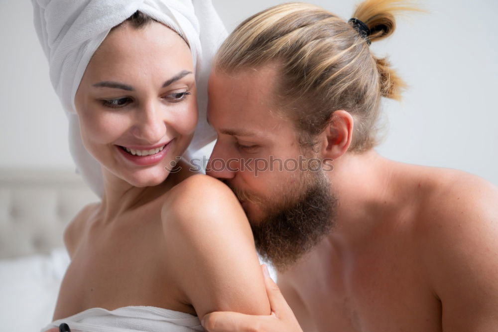 Similar – Happy couple embracing on bed