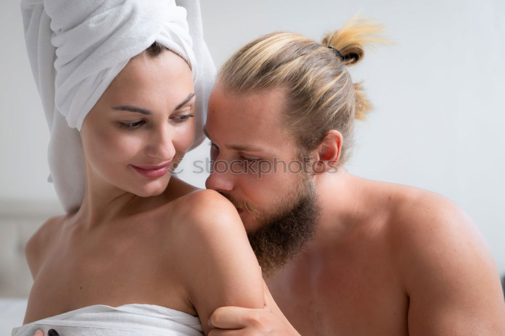 Similar – Happy couple embracing on bed