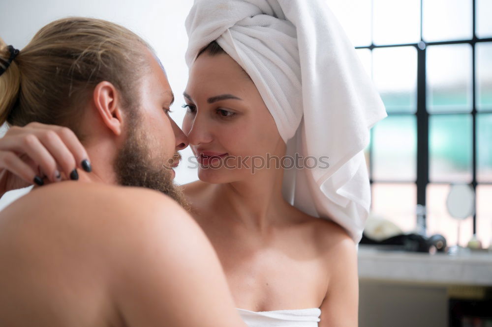 Similar – Happy couple embracing on bed