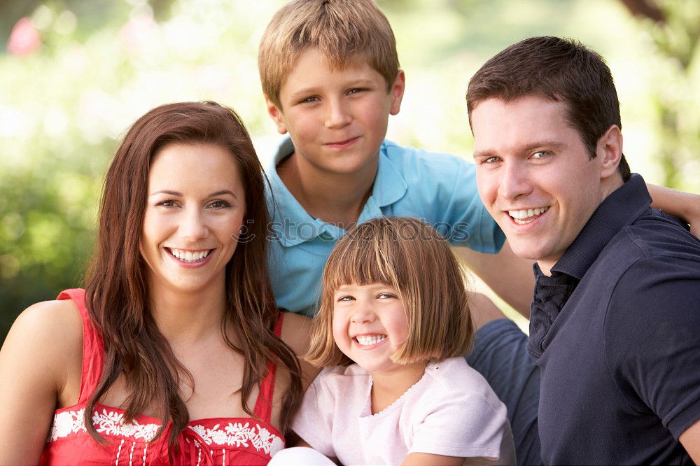 Similar – Happy family in a urban park playing with tablet computer