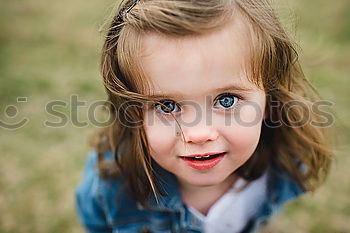 Image, Stock Photo Smiling girl between meadow with dry leaves