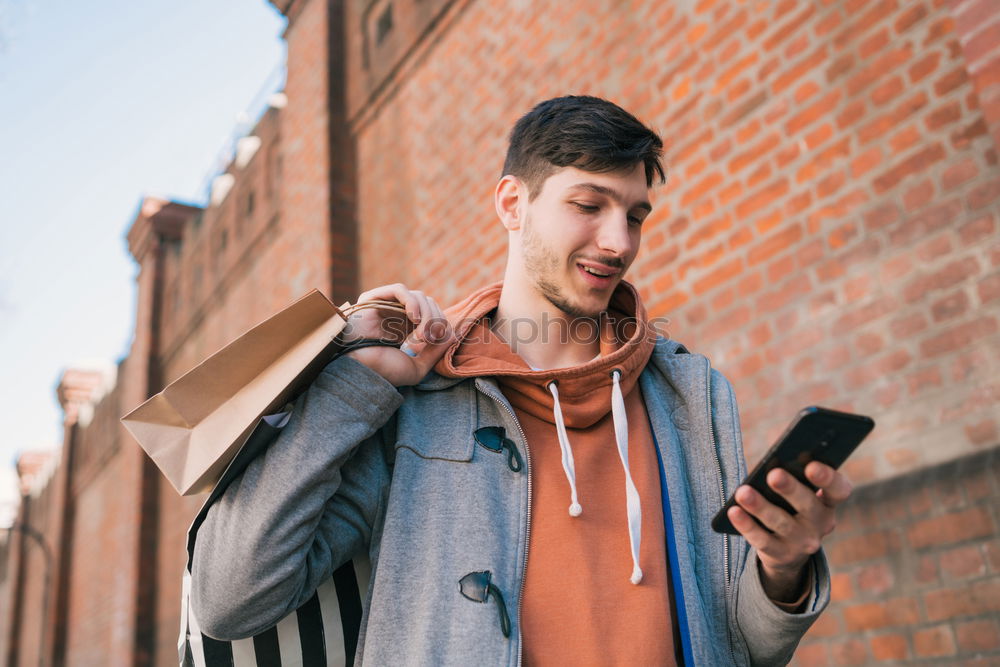 Similar – Image, Stock Photo Modern young man with mobile phone in the street.