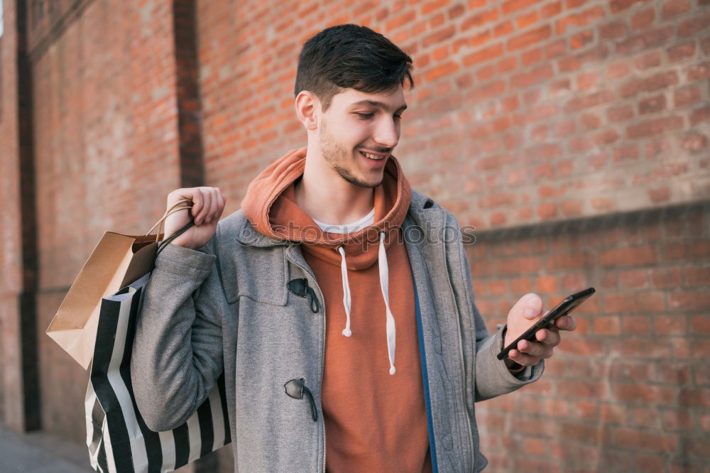 Similar – Image, Stock Photo Modern young man with mobile phone in the street.