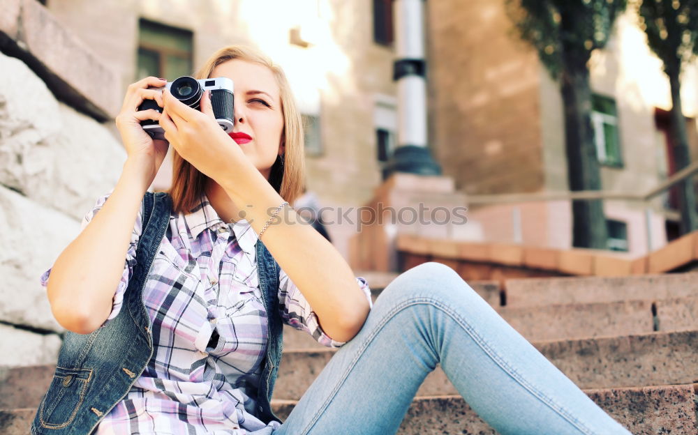 Similar – Young redhead woman taking shots with her analog camera