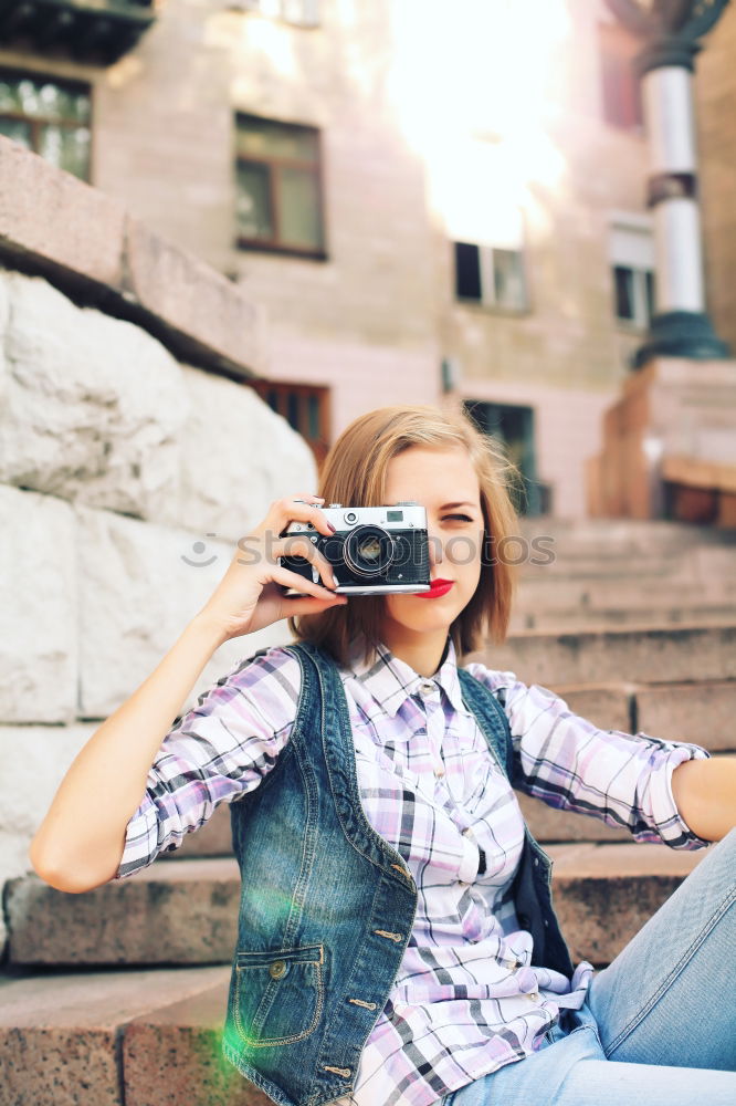 Similar – Cropped woman with vintage old camera