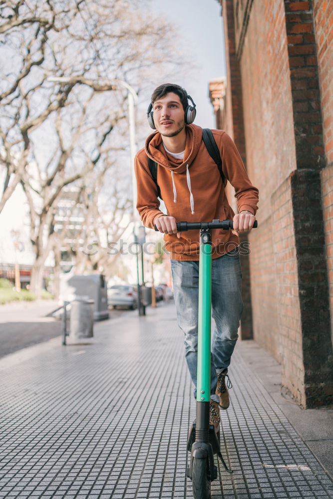 Similar – Handsome afro man walking with his bike.