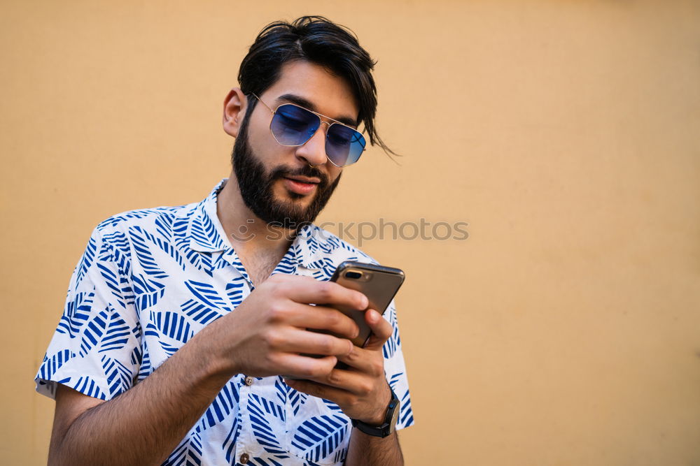 Similar – Image, Stock Photo Young black man using smart phone outdoors
