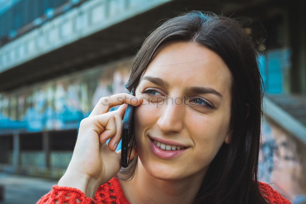 Similar – Smiling Woman in Autumn Fashion Talking on Phone