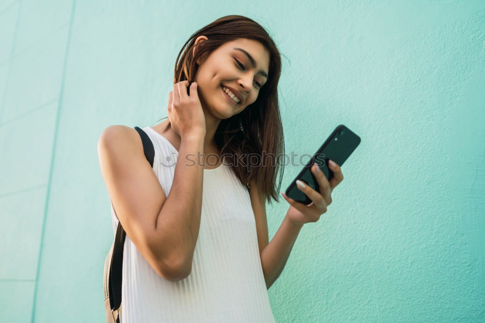 Similar – Image, Stock Photo Young beautiful woman in yellow dress using mobile phone