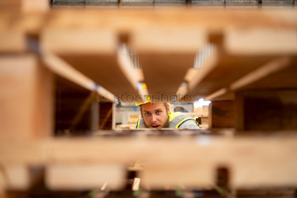 Similar – Image, Stock Photo Young man looks curiously over a barrier