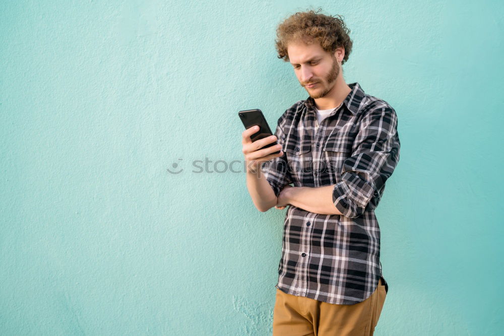 Man using his mobile phone.