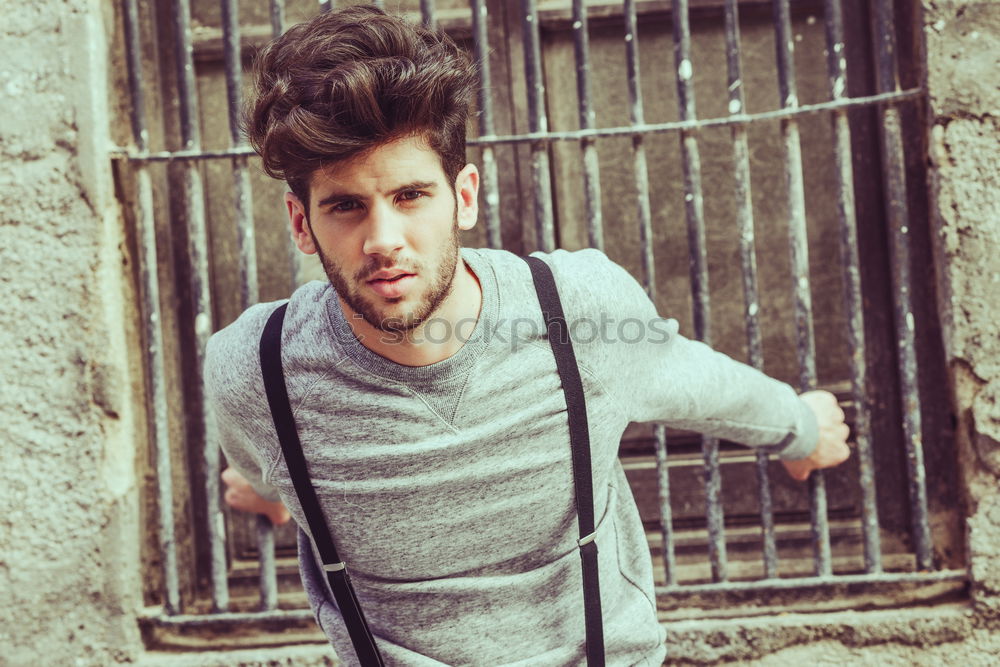 Similar – young man wearing suspenders in urban background