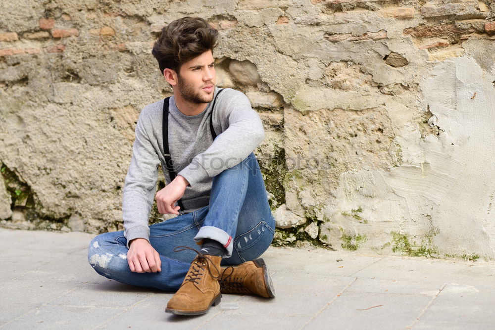 Similar – young man wearing suspenders in urban background