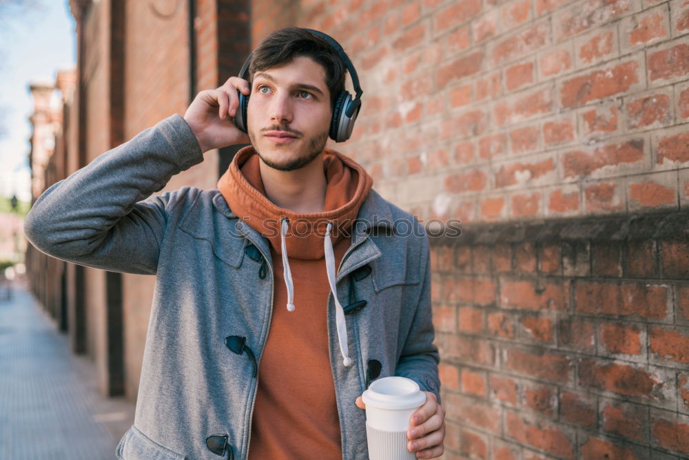 Image, Stock Photo Handsome man posing on orange wall