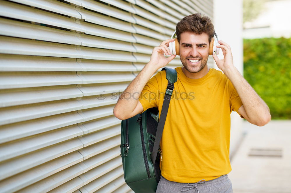Similar – Image, Stock Photo Young man waiting listening music and using mobile phone at the airport with a suitcase.