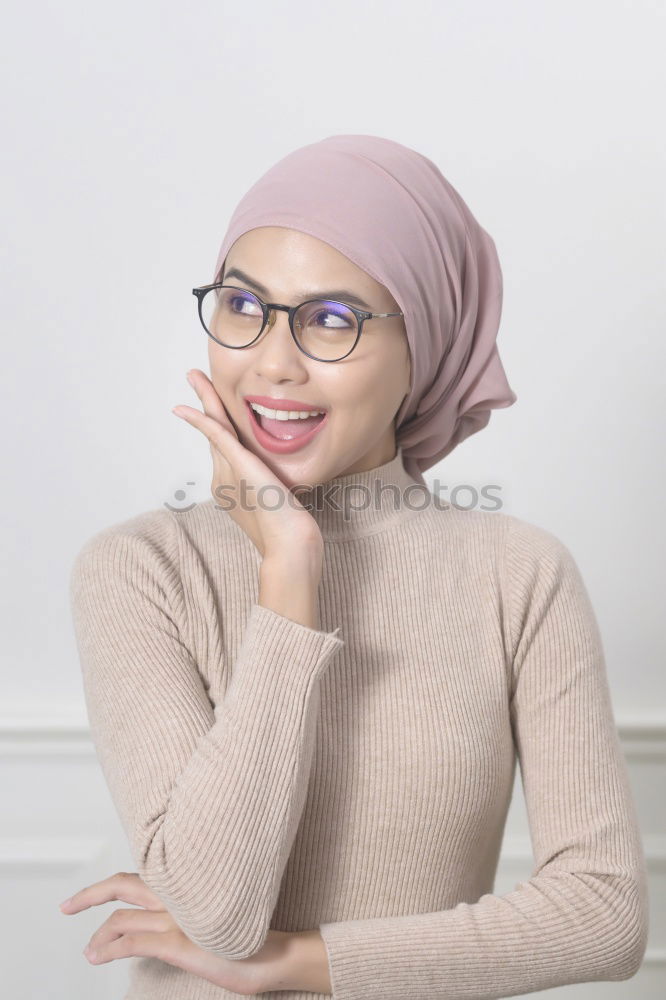 Similar – Smiling young woman wearing hijab outdoors