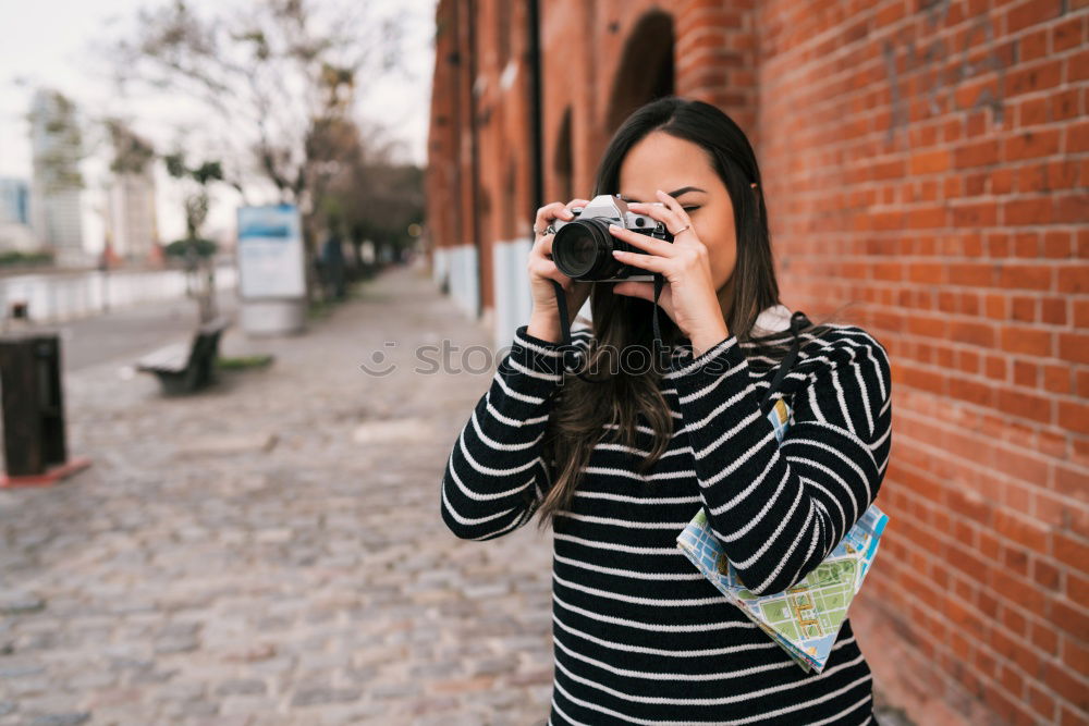 Similar – Blonde white woman holding an old VHS tape and playing with it.