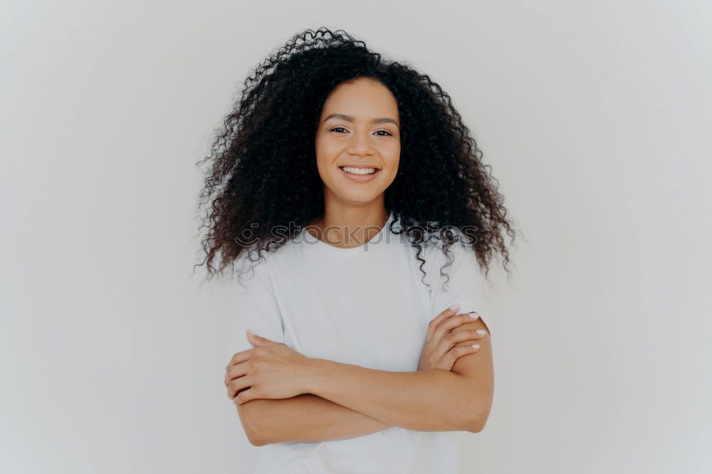 Similar – close up of a pretty black woman with curly hair smiling sit on bed looking at the camera