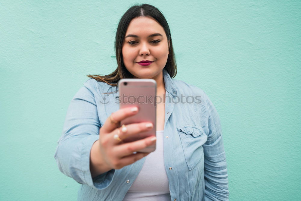 Similar – Image, Stock Photo Young woman in yellow dress using mobile phone