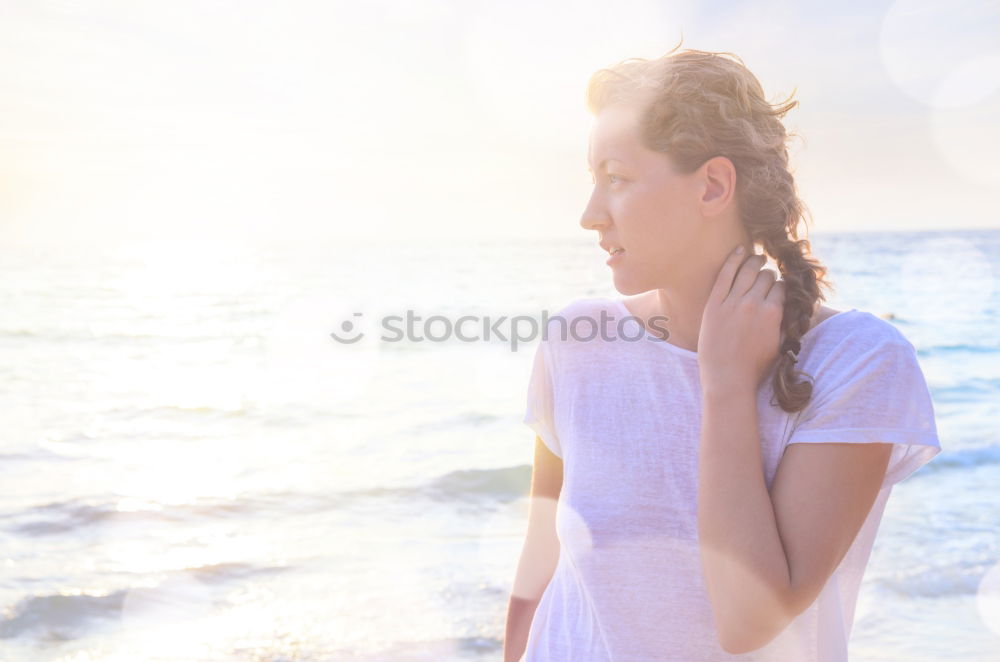 Similar – Young dreamy woman at seaside