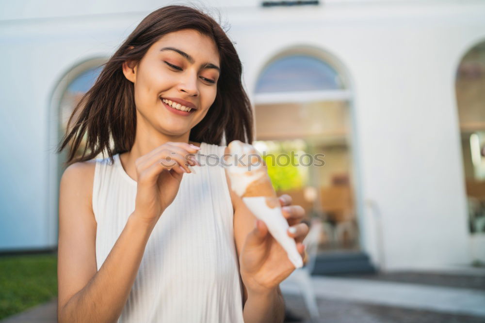 Similar – Woman posing sitting in outside cafe