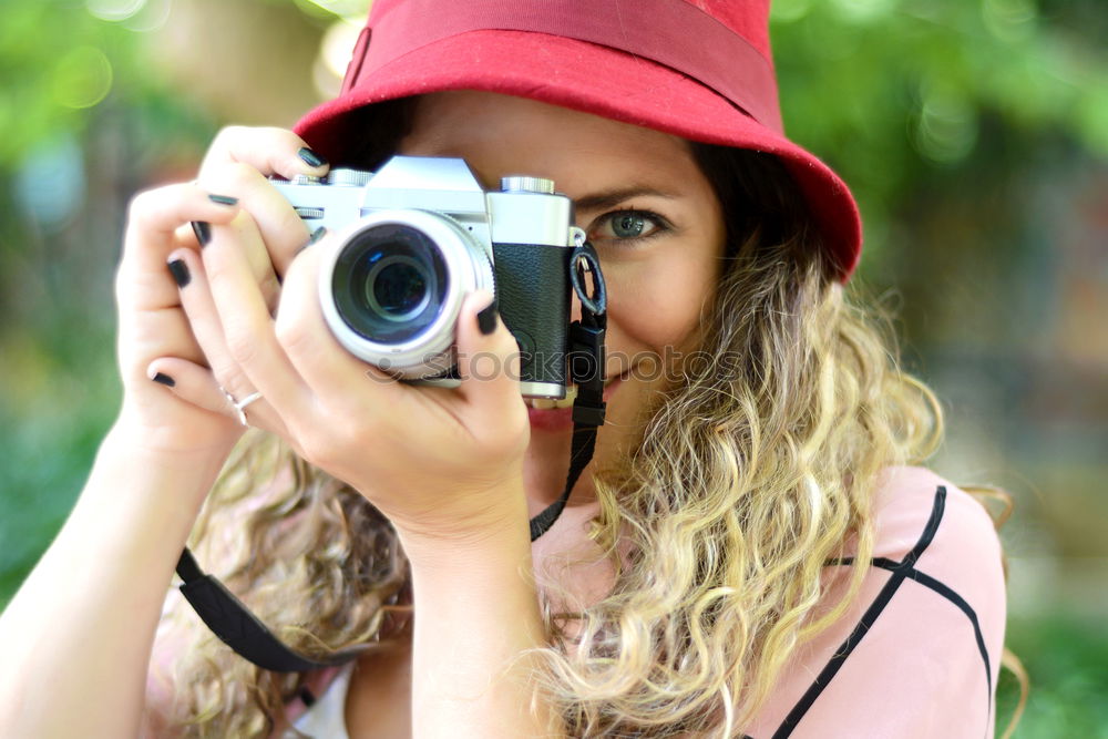 Similar – Cropped woman with vintage old camera