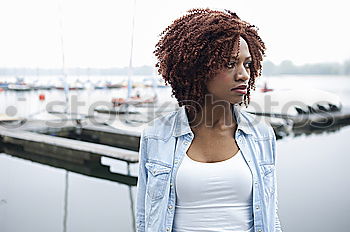 Similar – Ethnic woman at white wall