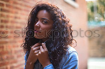 Similar – Black woman with afro hairstyle sittin on a urban bench