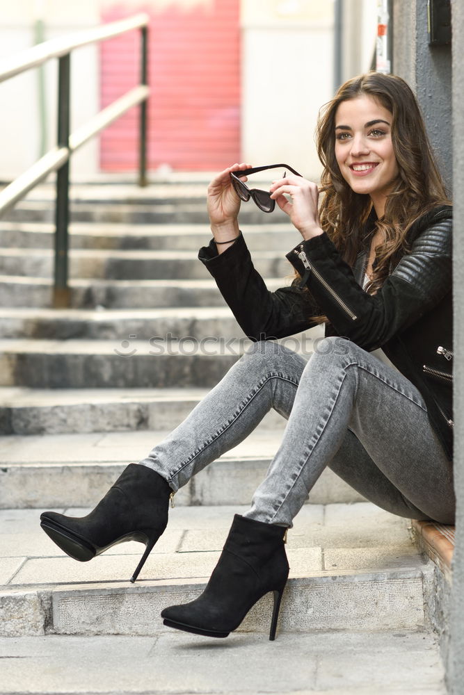 Similar – Image, Stock Photo African woman with black curly hairstyle sitting on urban floor.