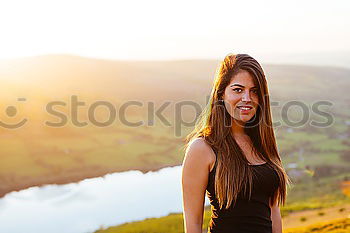 Similar – Image, Stock Photo Cheerful woman in bright light on nature