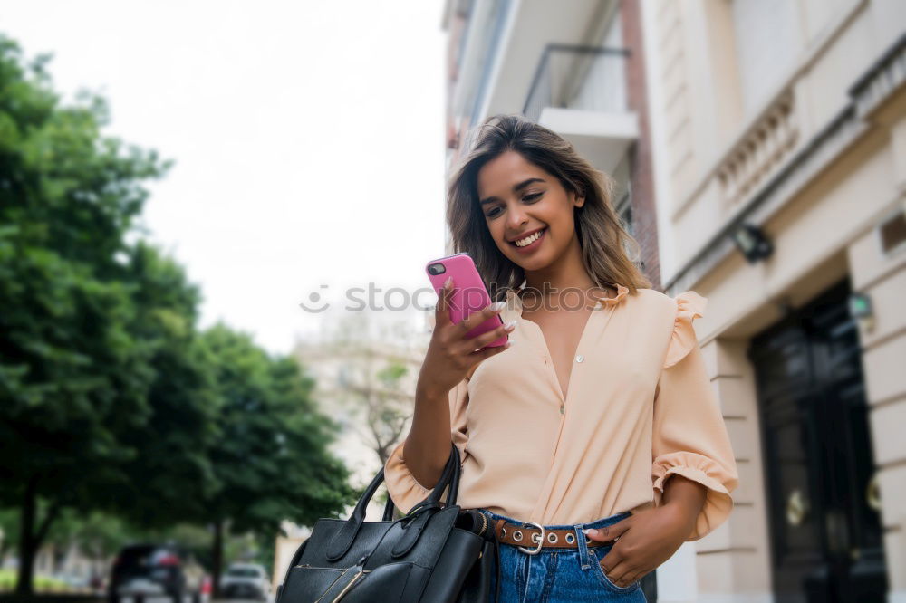 Similar – Image, Stock Photo African woman walking on the street looking at her smart phone