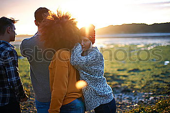 Similar – Image, Stock Photo Group of female friends hugging each other in sunset