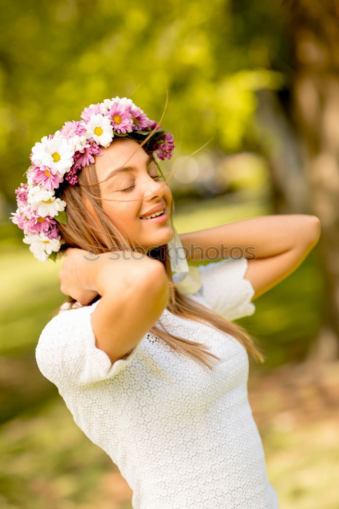 Similar – Young black woman with afro hairstyle smiling in urban park